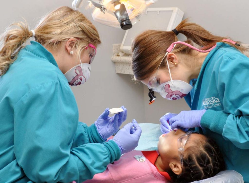 dentistry students with patient